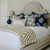 Bedding & Bath at Bountiful Home - custom chinoiserie pillows and tan and white zebra throw blanket on an upholstered bed
