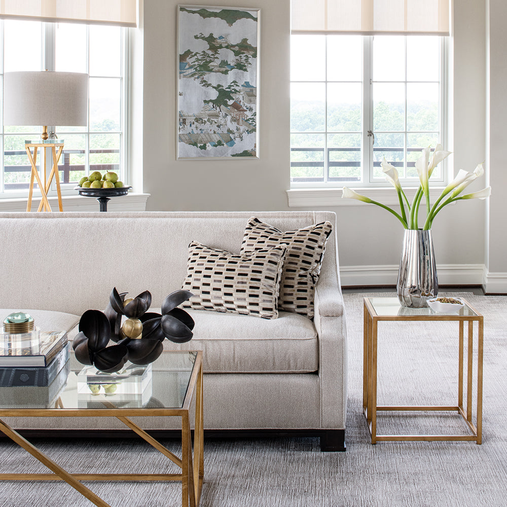 contemporary living room with neutral color palette and gold accents by Jamie Merida Interiors