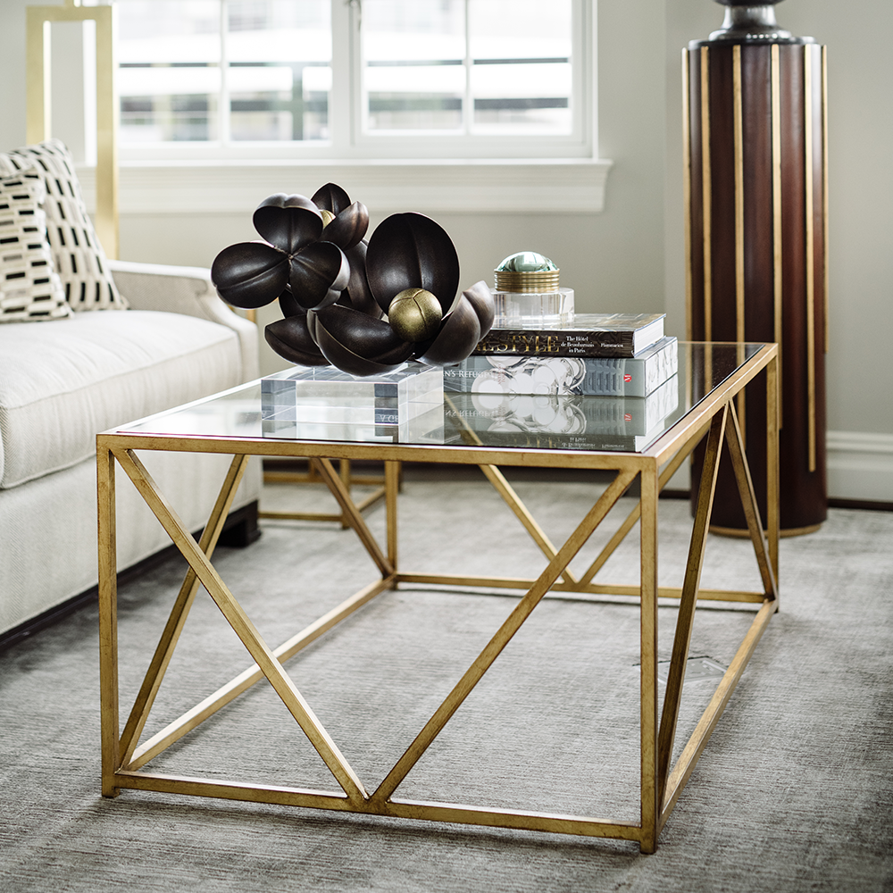 Glass-Top Harlequin Coffee Table from the Jamie Merida Collection for Chelsea House - antique gold base with glass top isolated on white background